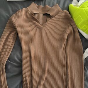 Light brown tight long-sleeves dress.